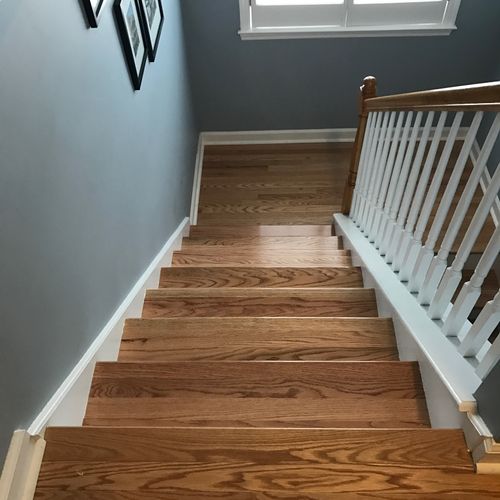 Carpet off the stairs and new hardwood treads!