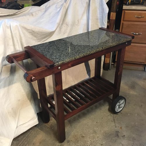 This beautiful piece is an indoor- outdoor cart th