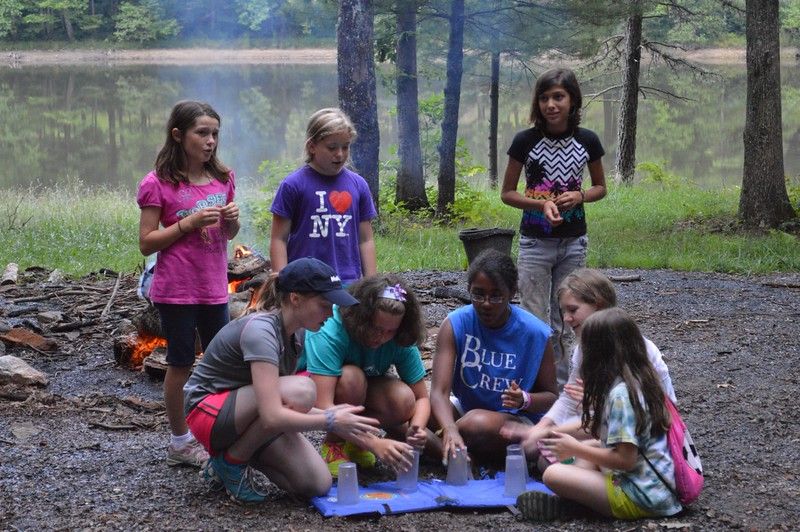 Performing at the campfire with my cabin when I wa