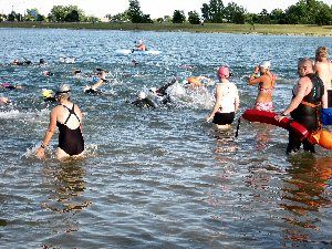 Coach Ken Johnson escorting open water swimmers at
