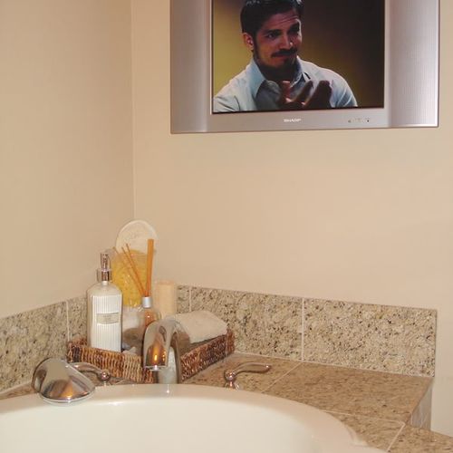 An example of a television mounted in a bathroom w