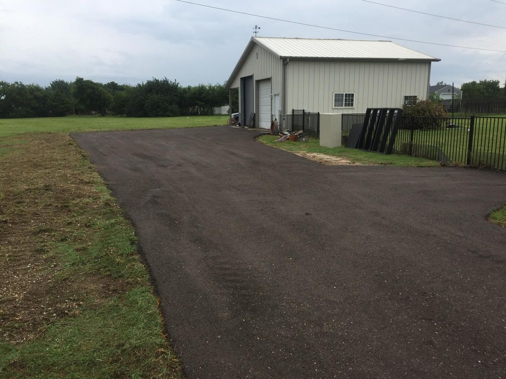 Recycled Asphalt shop entry and parking area.