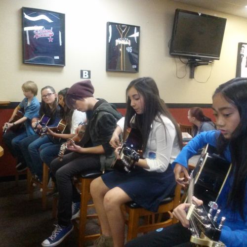 Guitarlina students getting ready to perform
