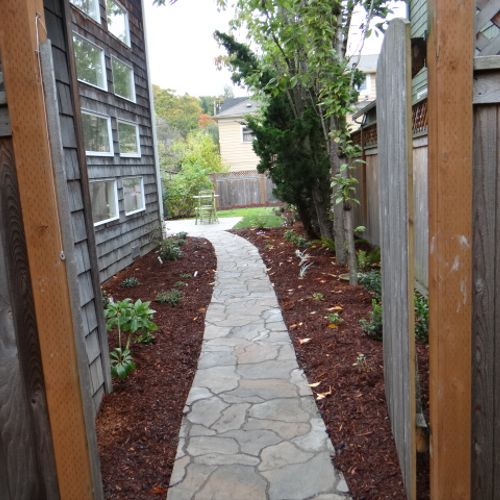 Install flagstone path from side yard entry gate i