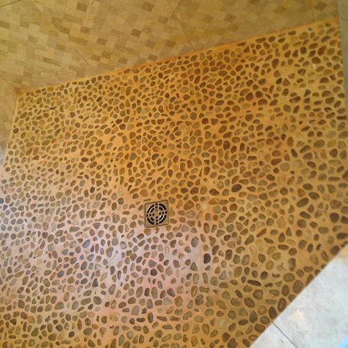 Stone shower floor before.