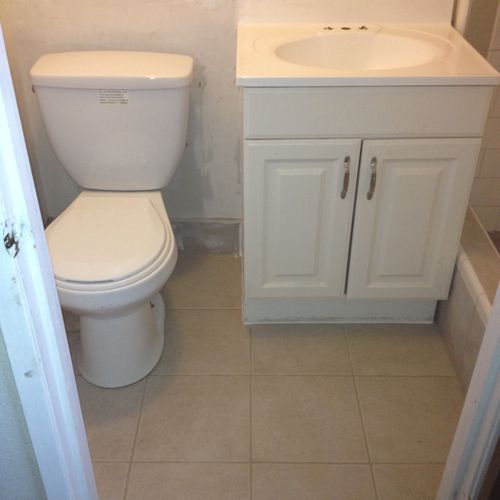 new toilet, sink and tile