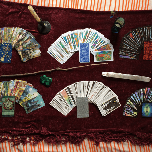 Six of the nine tarot decks I use -- clockwise fro