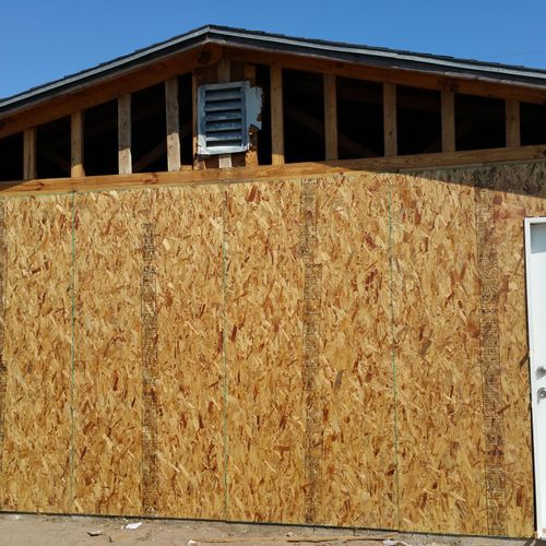Installed new sheathing and vapor barrier.