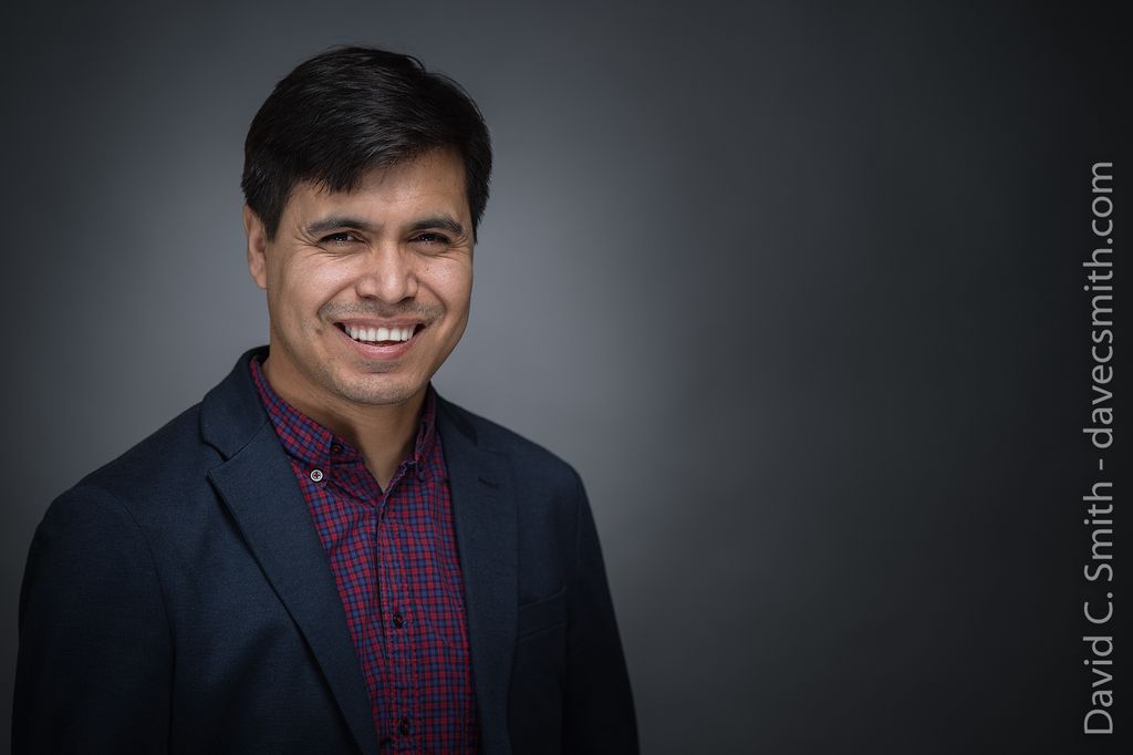 A simple professional headshot in studio.