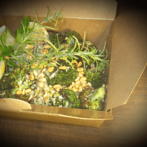 Rosemary herbed broccoli florets tossed with pine 