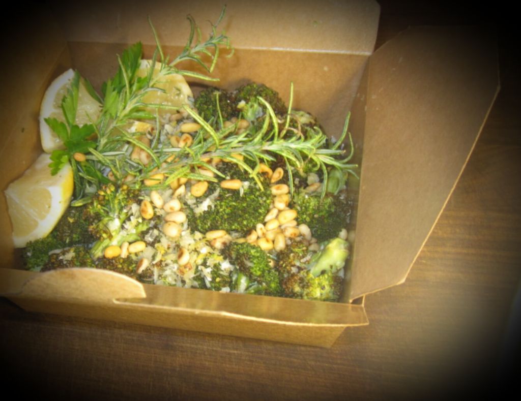 Rosemary herbed broccoli florets tossed with pine 