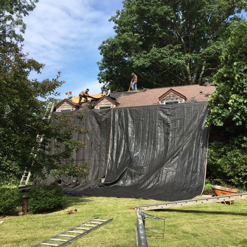 Tarps used during stripping of old shingles to pro