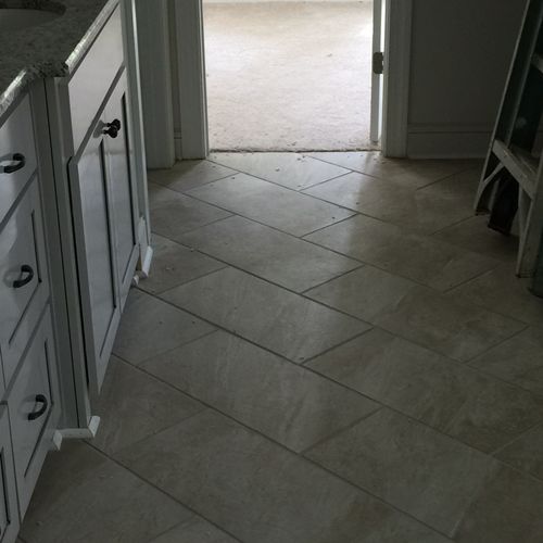 Bathroom Floor Using Impervious Porcelain Tile. 

