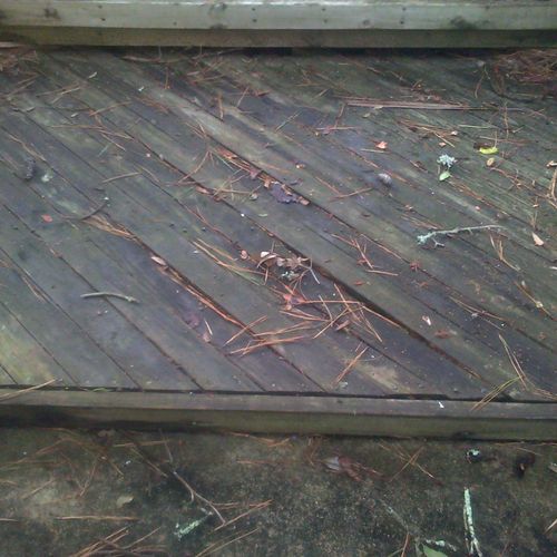 This picture shows an old wooden deck that was bad