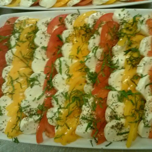 Caprese Platter with yellow and red tomatoes, fres