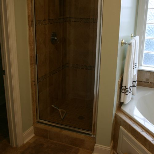 Custom built one person shower adjacent to jacuzzi