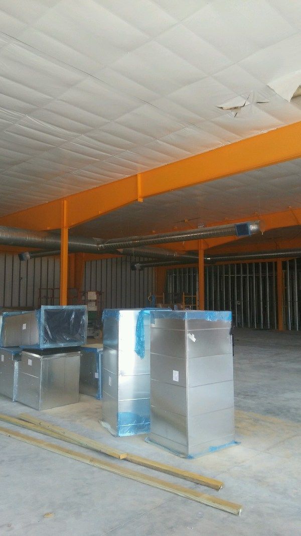 After spraying the structural steel.