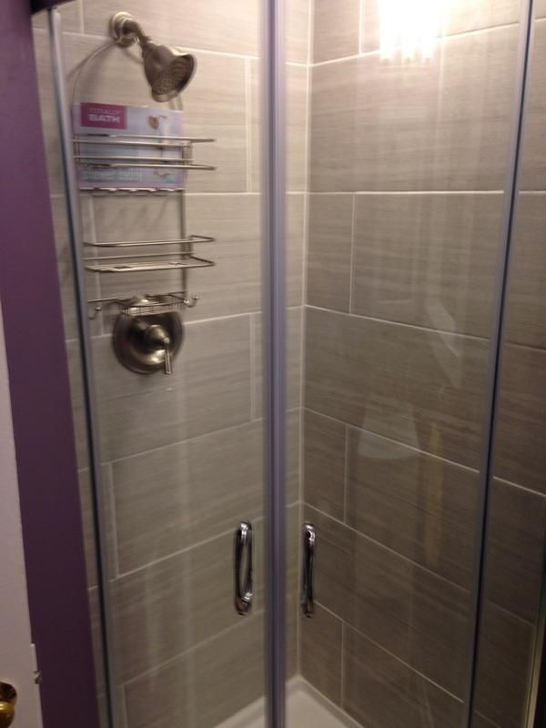 Corner surround shower with tile surround