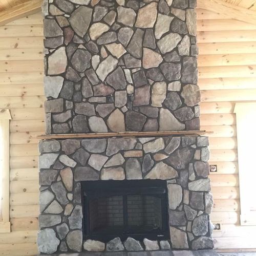 Field stone fireplace in cabin