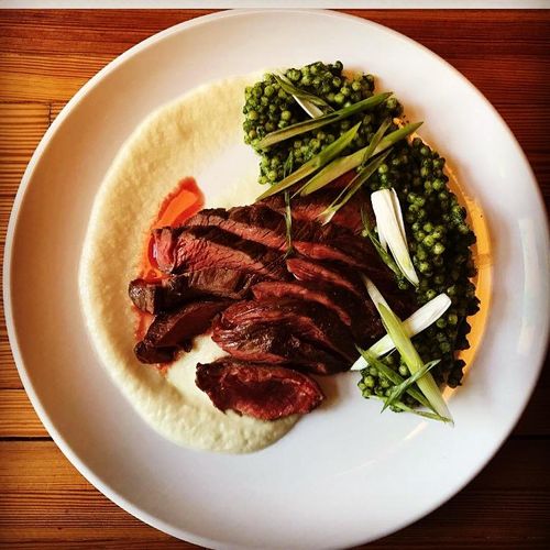 Grilled Hanger Steak with Sweet Onion Puree and He