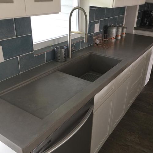 Concrete kitchen countertop with integrated sink a