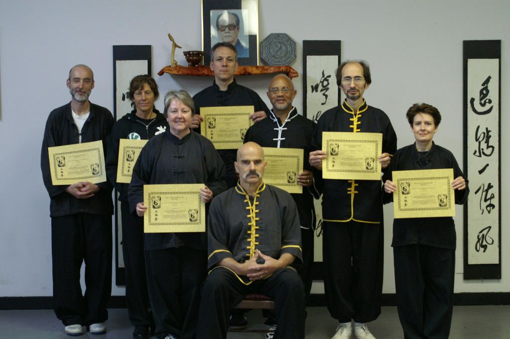 Disciples displaying their teaching certificates. 