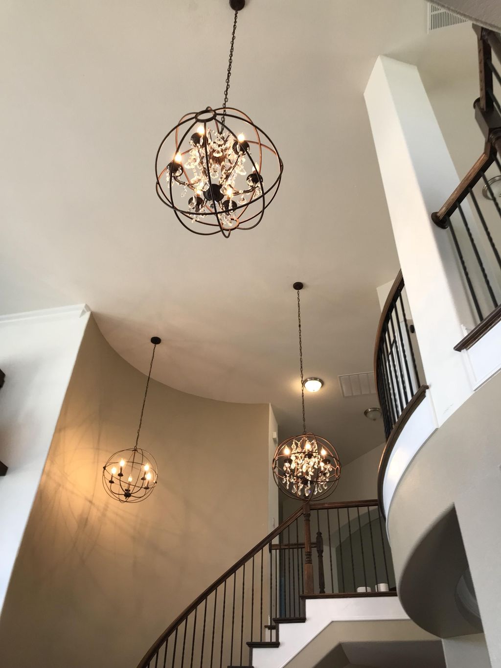 Hung these chandeliers. 20’ ceiling 