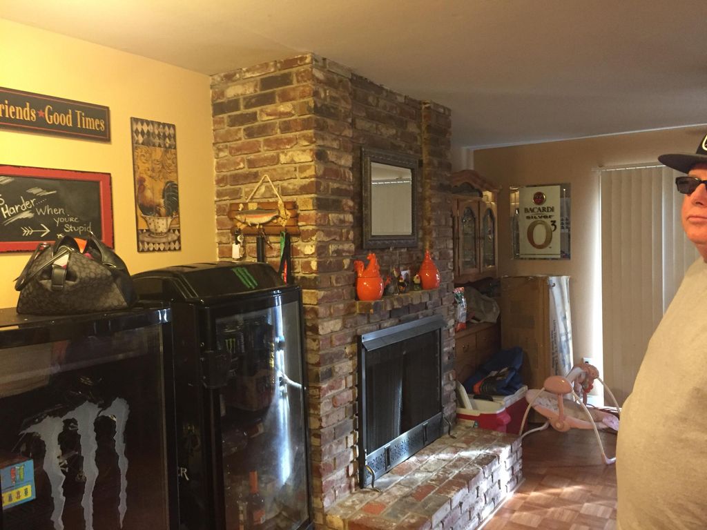 Remove fireplace and turn two small rooms into one