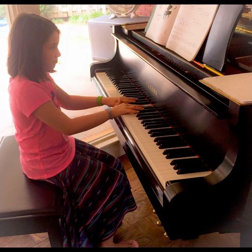 Bella at the piano.  (1st year student).