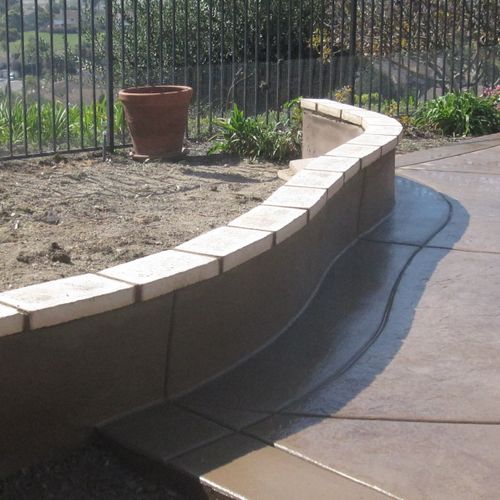 Poured in place planter wall with slump stone cap.