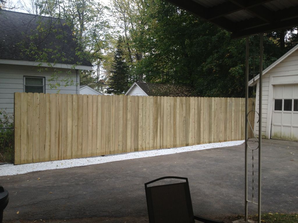 Bush removal, stockade fence and stone installatio