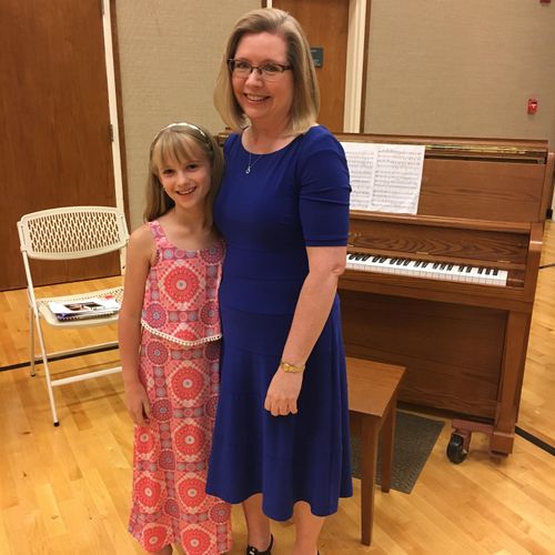 A very proud teacher and bright young piano star!
