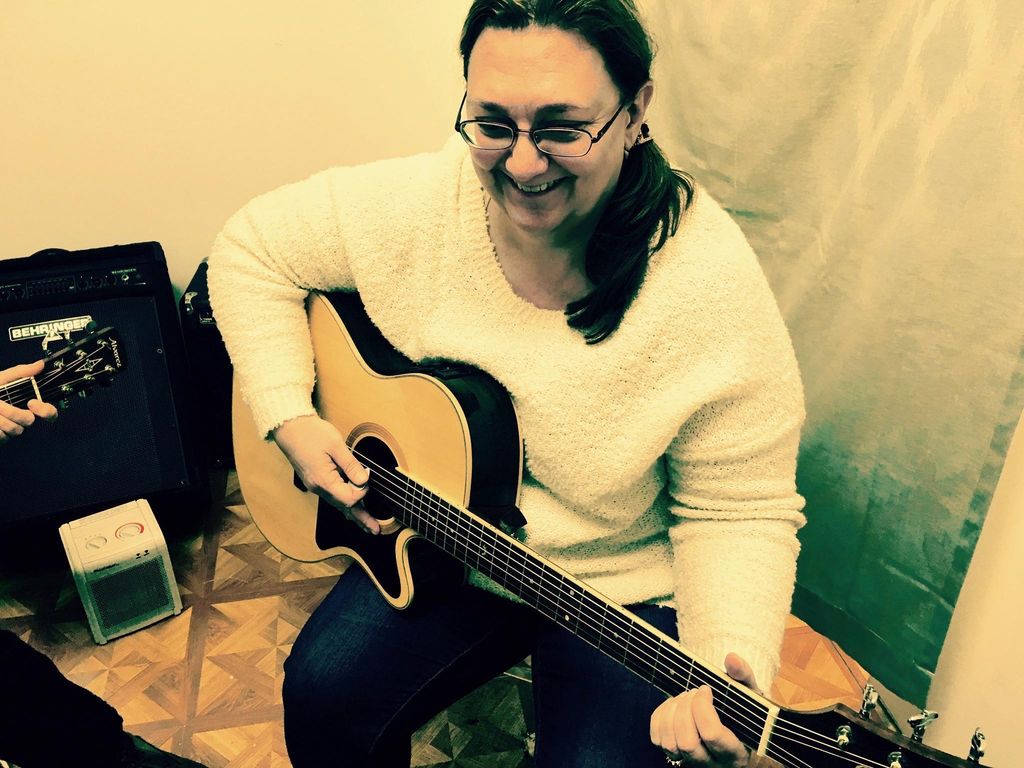 Colleen - intermediate guitar student, plays for h