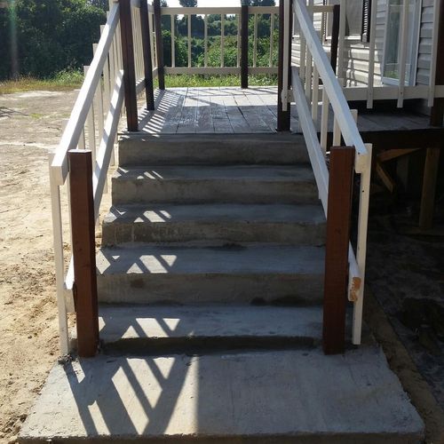 Front concrete steps to deck entry