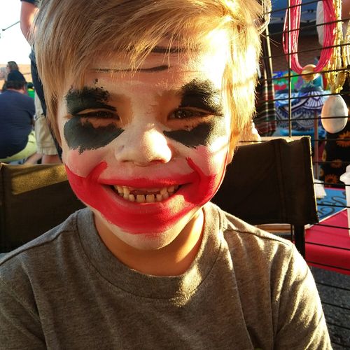 Kids face painted at Benson First Friday, this you