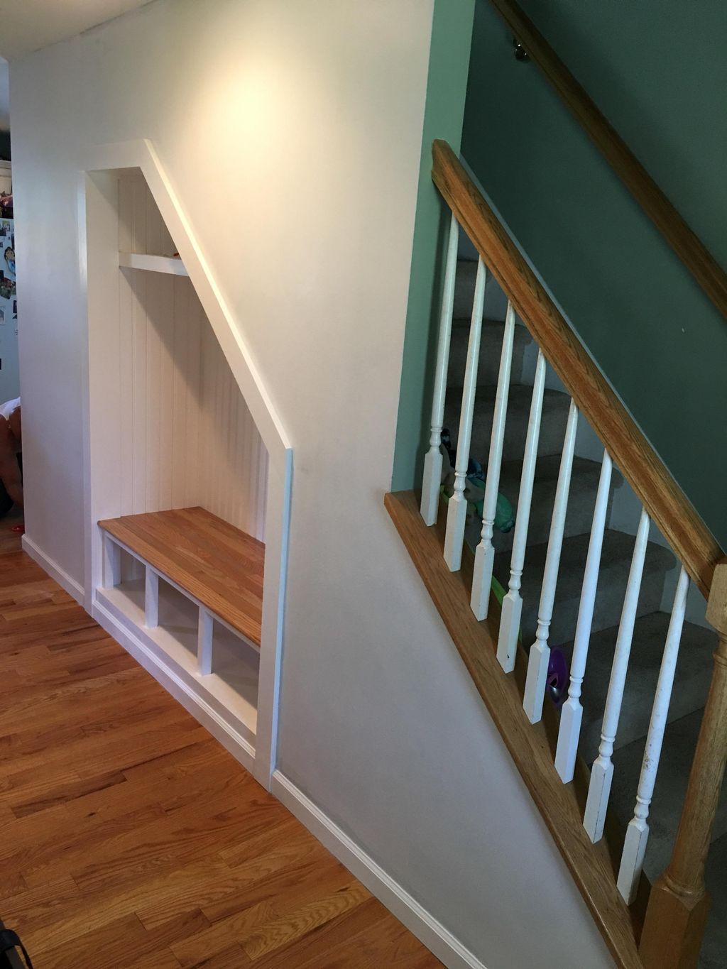 Lost space under the stairs becomes a custom nook 