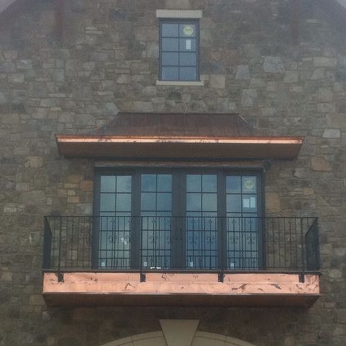 Balcony installed with iron handrail and copper tr