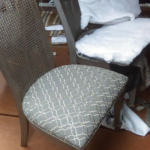 Re-upholstered dining chairs with fabric of client