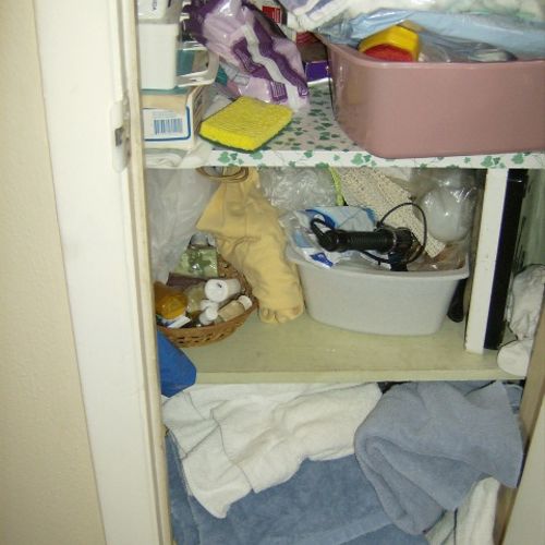 Collection of clutter including linens, medicines,