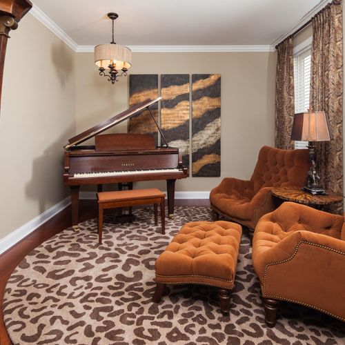 Music room showcasing existing baby grand piano