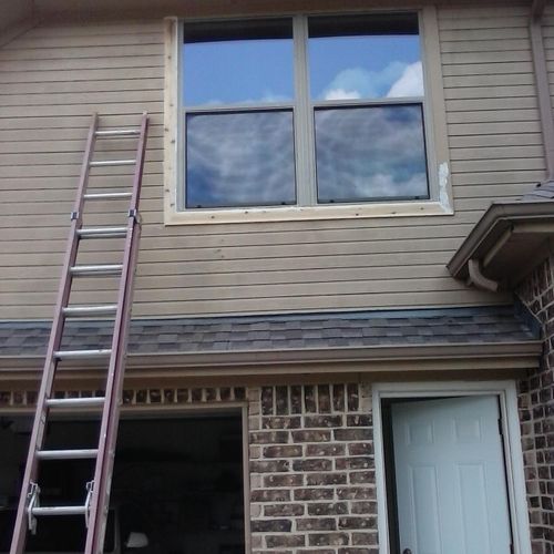 Window trim replacement, caulking, and painting.