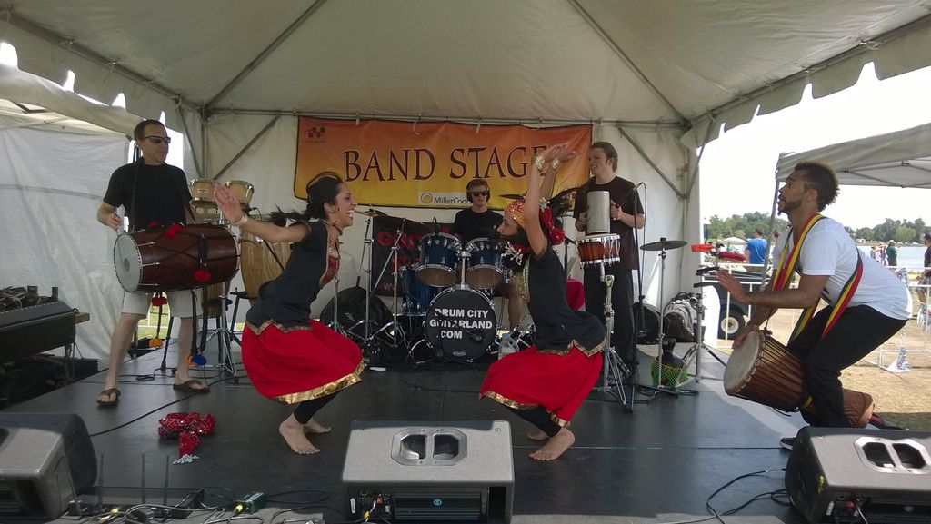 Mike Playing percussion with rapper SF1 at the Col