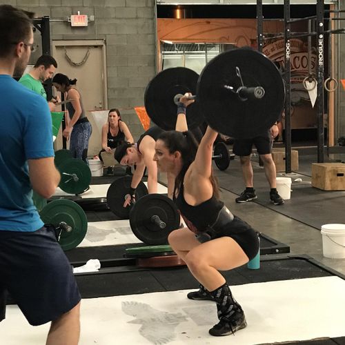 Performing a snatch at a crossfit competition 