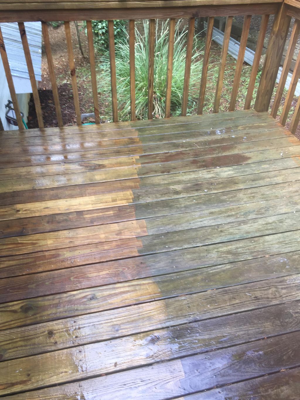 Pressure washing wood deck. 