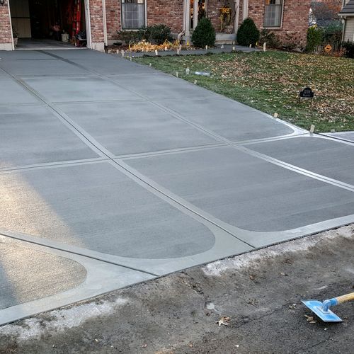 Tear out & Replaced concrete driveway. Custom roun