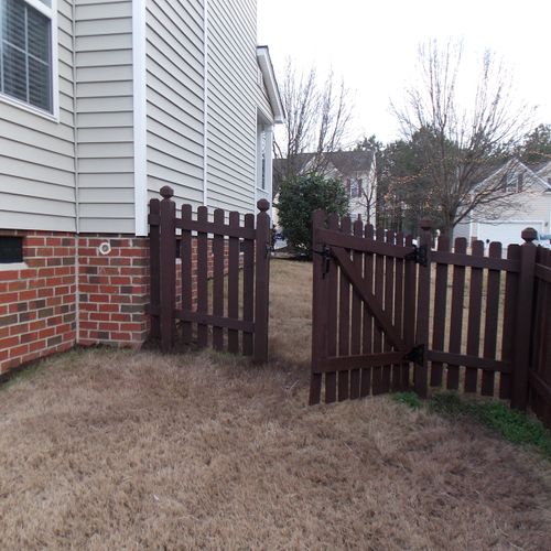 Construction -Fence power washed and restained