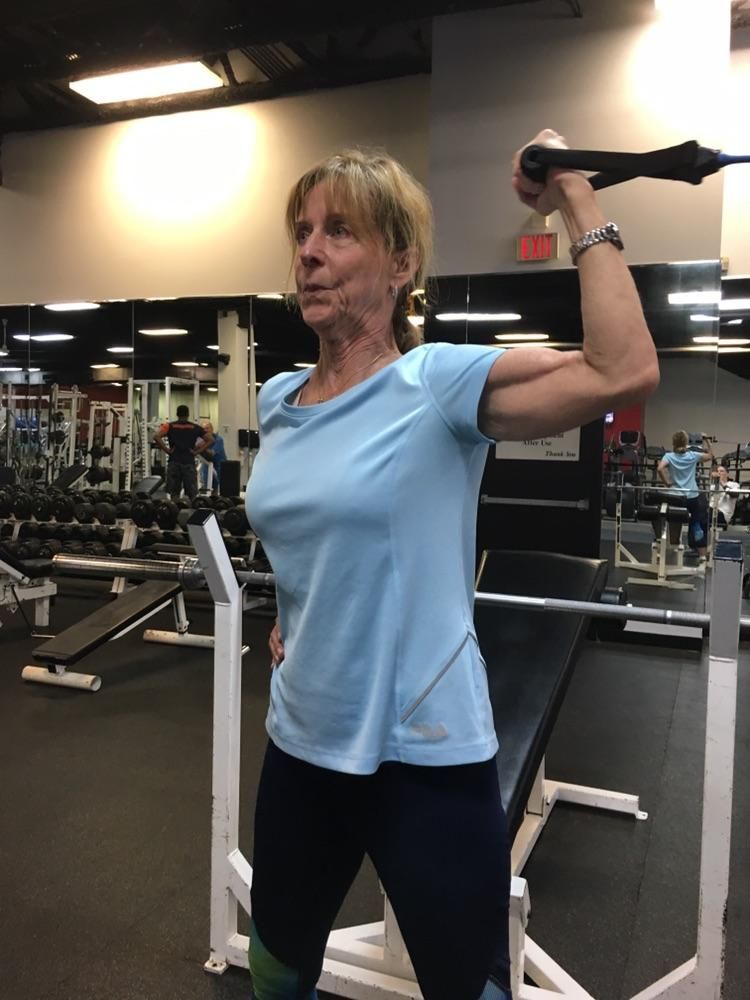 One arm band curl, nice bicep, 73 yrs old