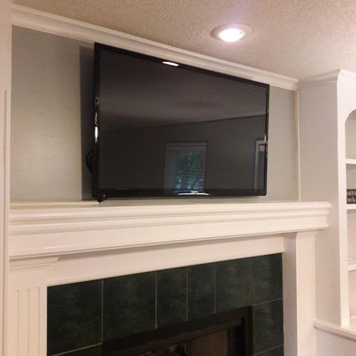 Installation of TV above fireplace. Equipment is s