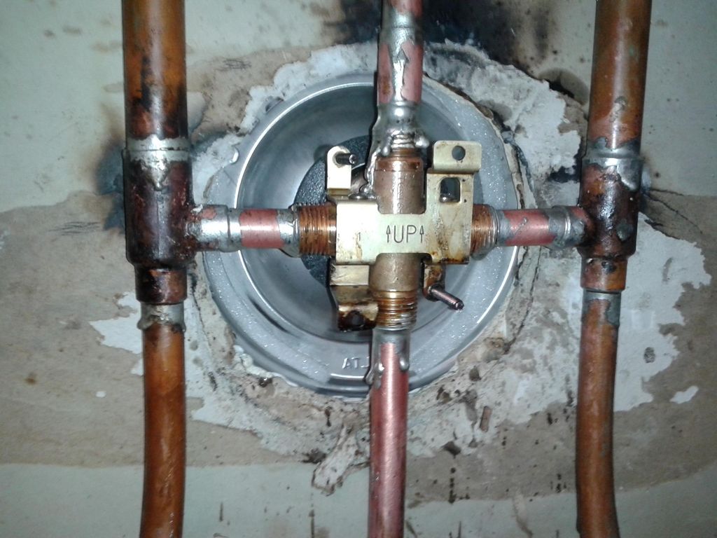 Install new Delta tub and shower valve  behind wal