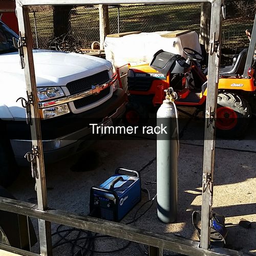 Custom trimmer rack with spring loaded hooks